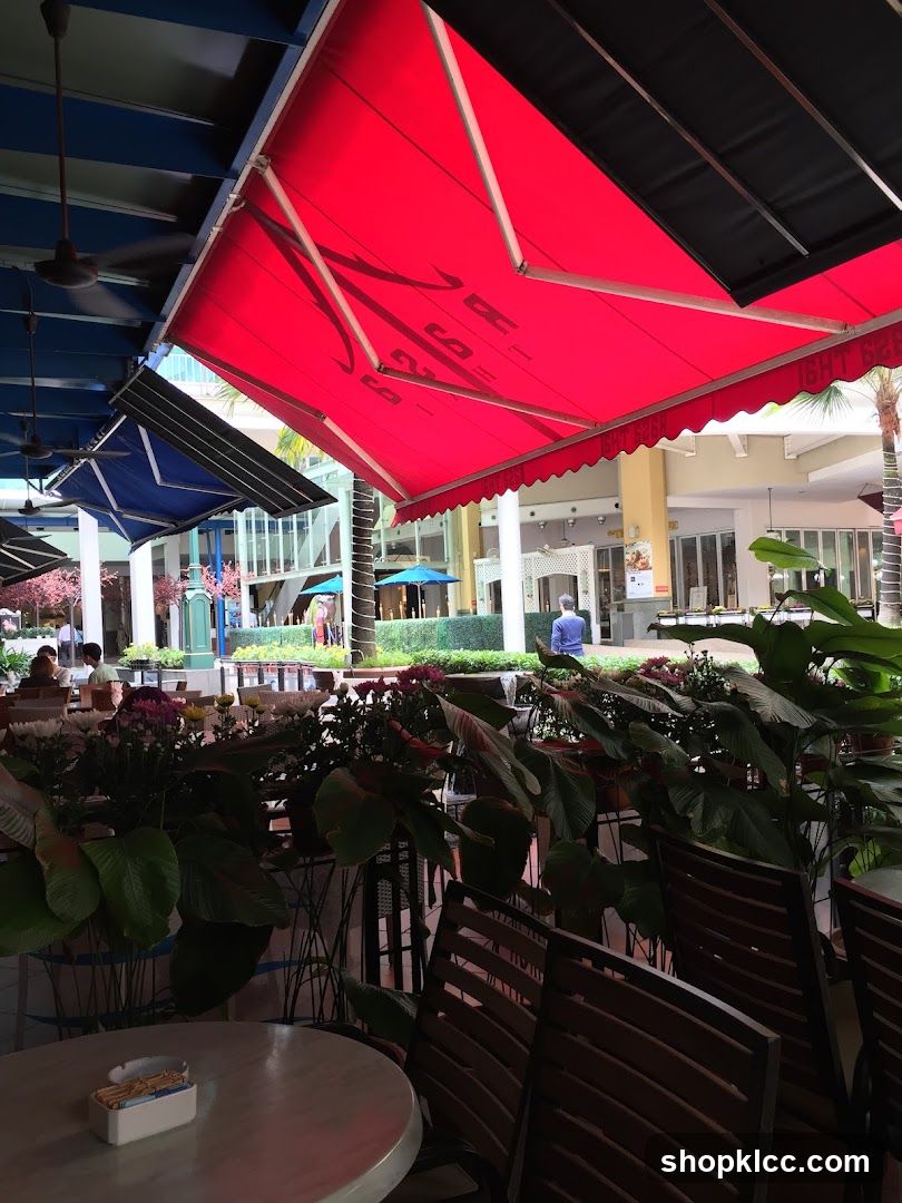 Outdoor Seating Area with Red Awning