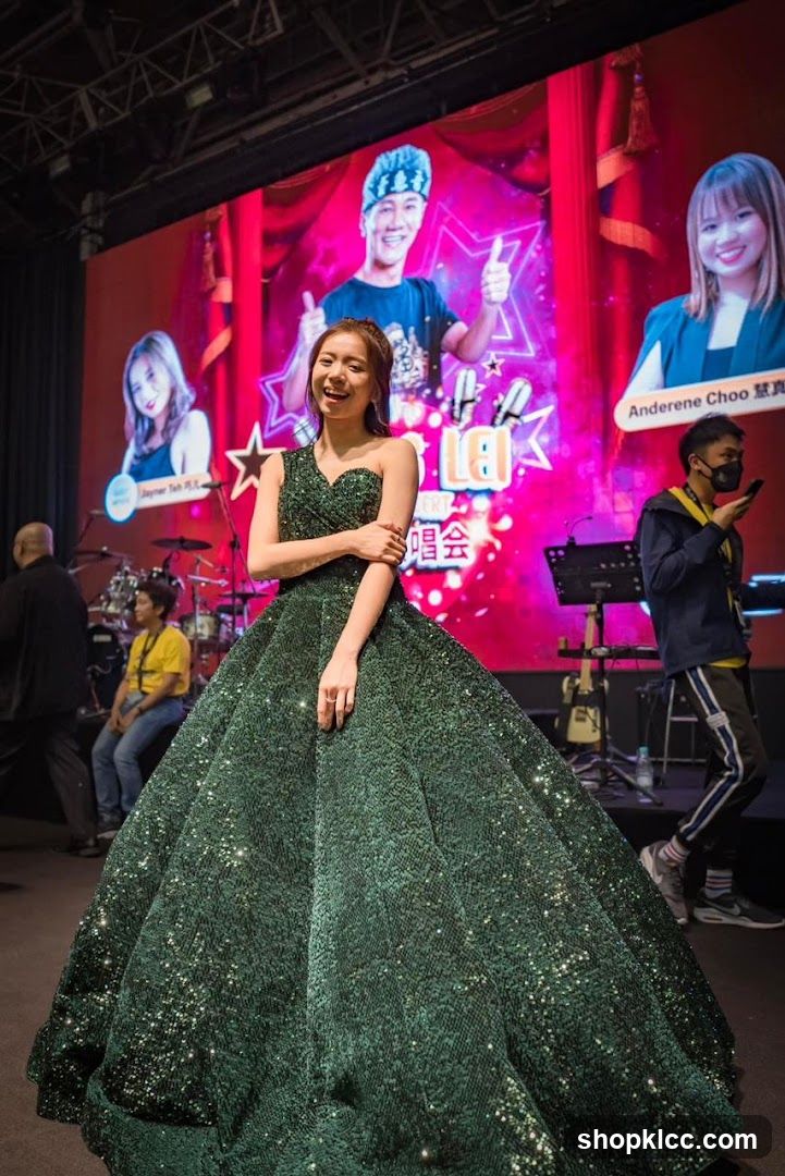 Woman in Green Sequin Gown on Stage
