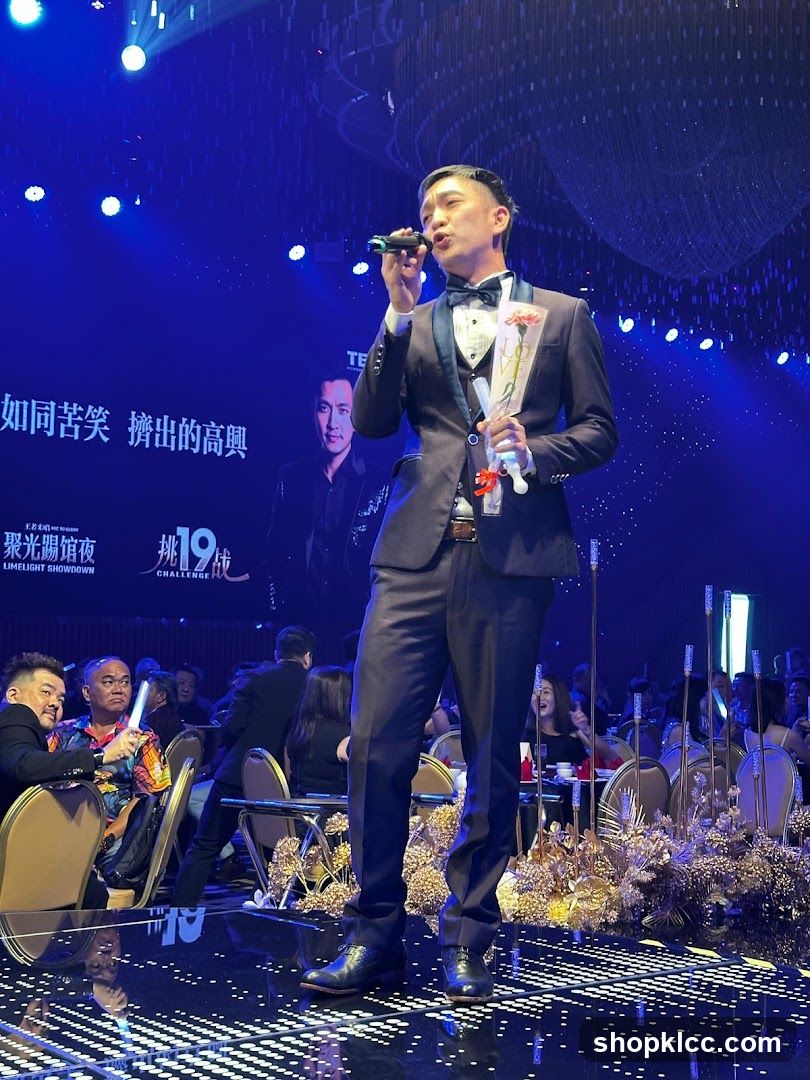 Man speaking into a microphone at an event