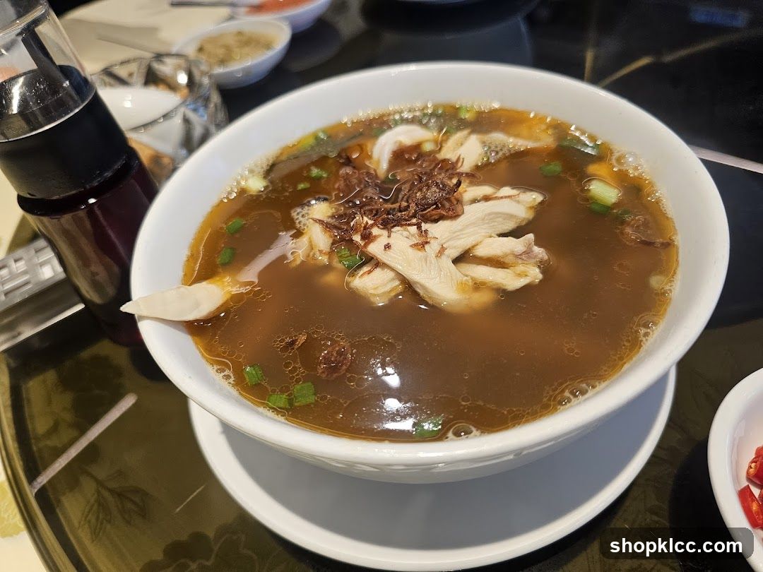 Bowl of Chicken Soup with Fried Shallots and Green Onions