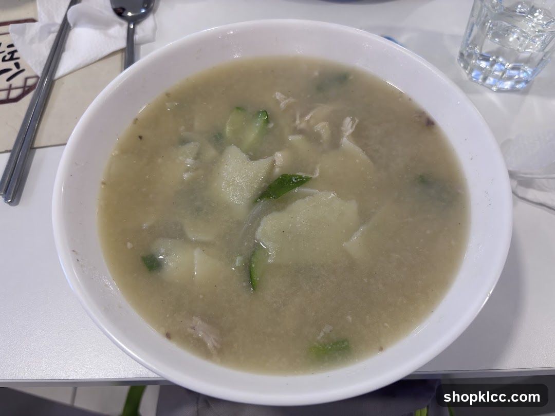 Bowl of Soup with Vegetables and Meat