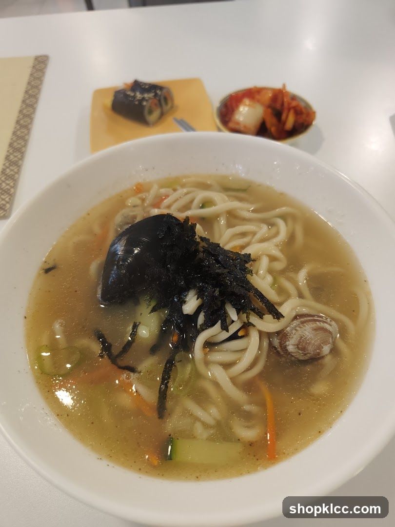 Bowl of Noodle Soup with Side Dishes