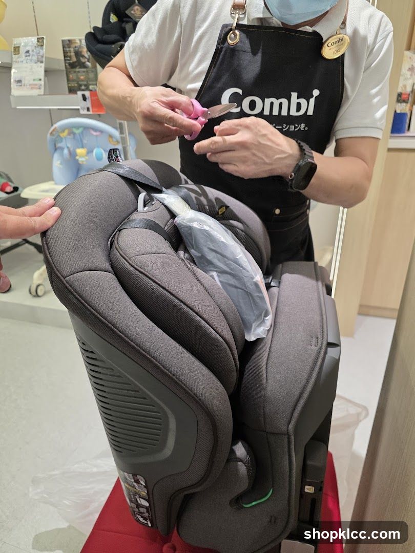 Employee opening packaging for a car seat