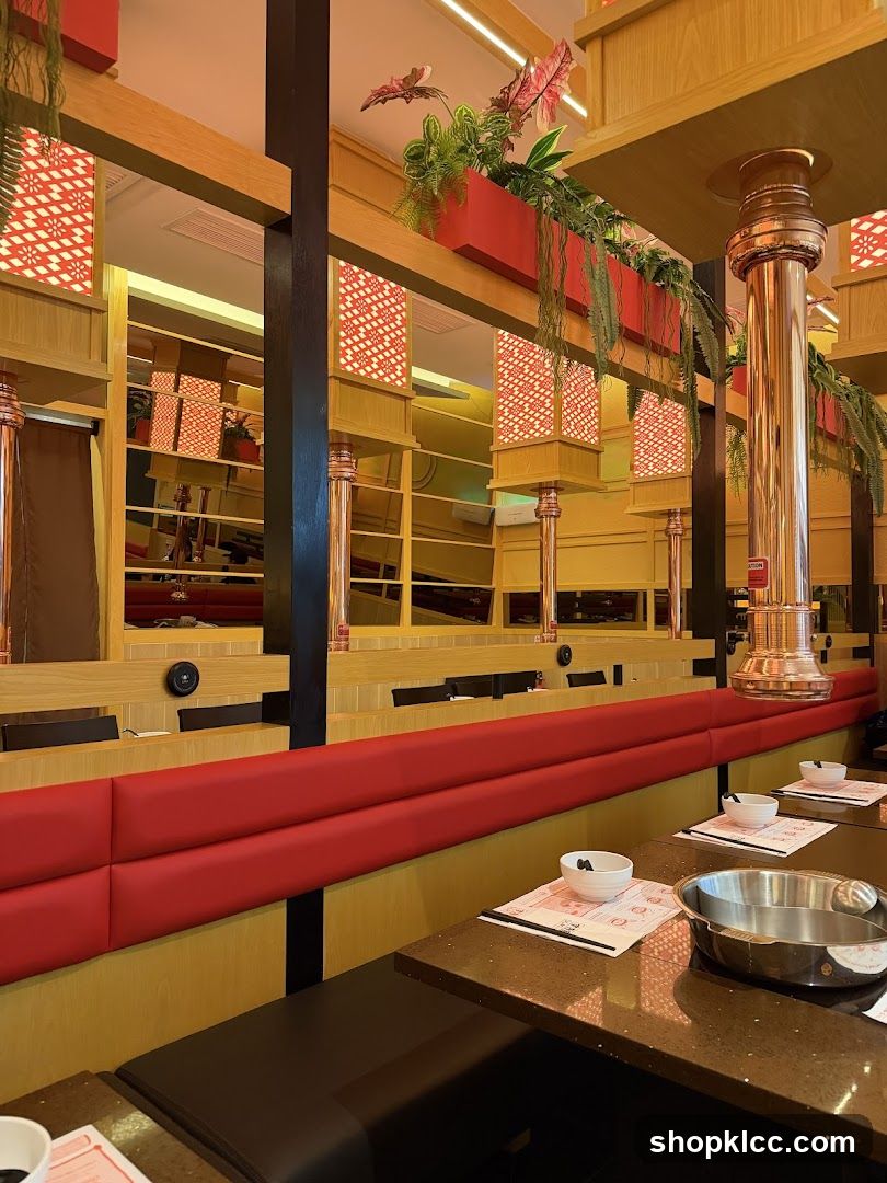 Restaurant Interior with Red Booths and Hanging Plants