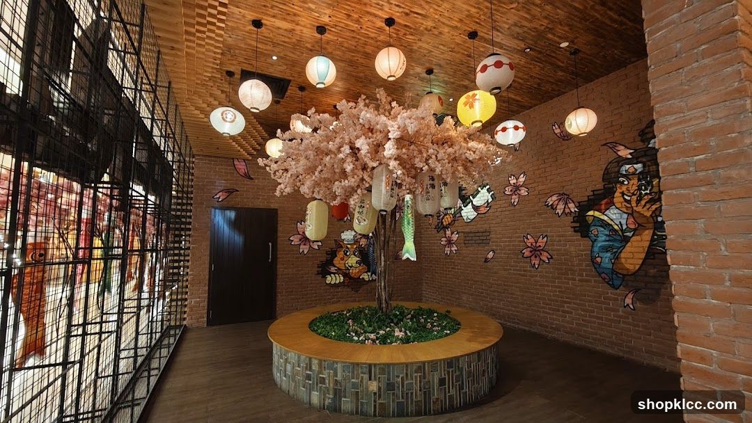 Japanese-themed interior with cherry blossom tree and lanterns