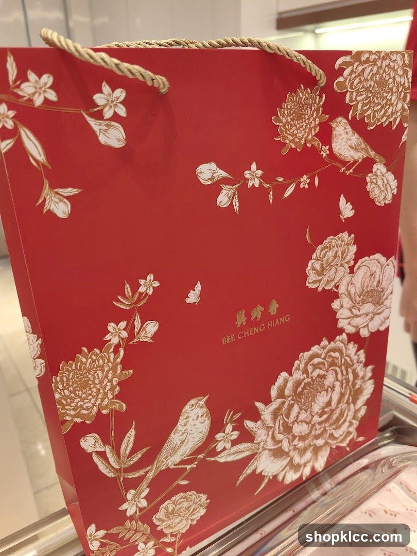 Red Gift Bag with Floral and Bird Design