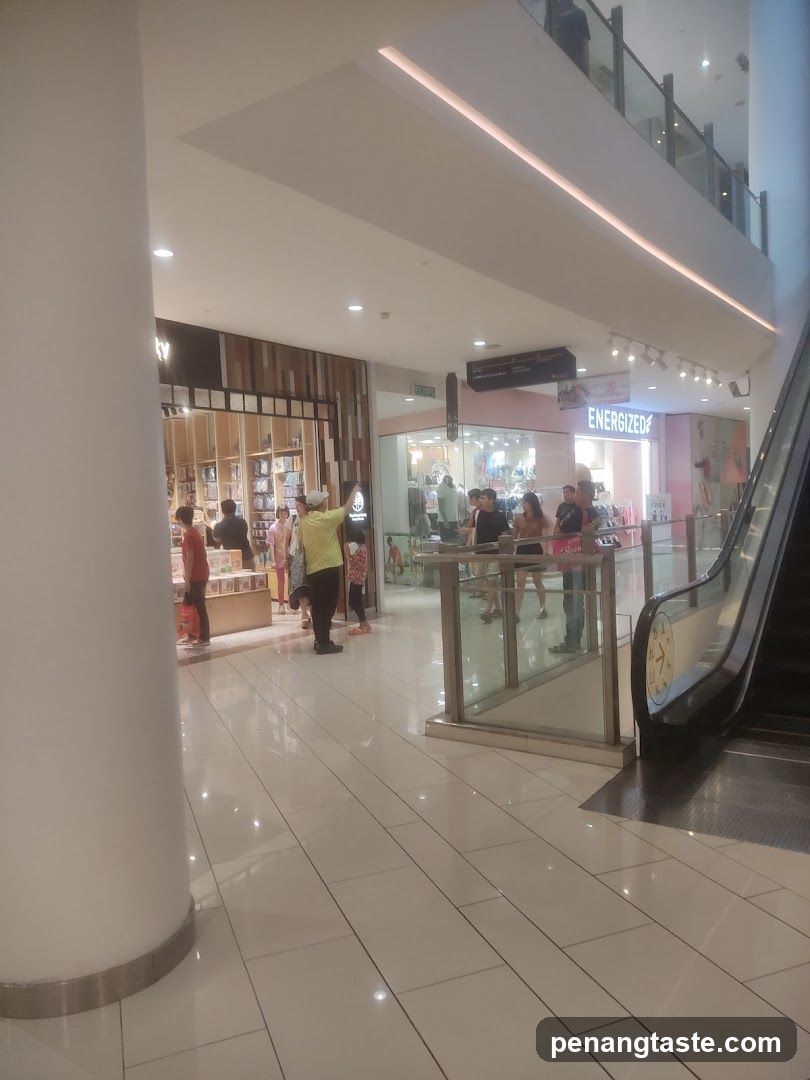 Mall Interior with Shops and Escalator