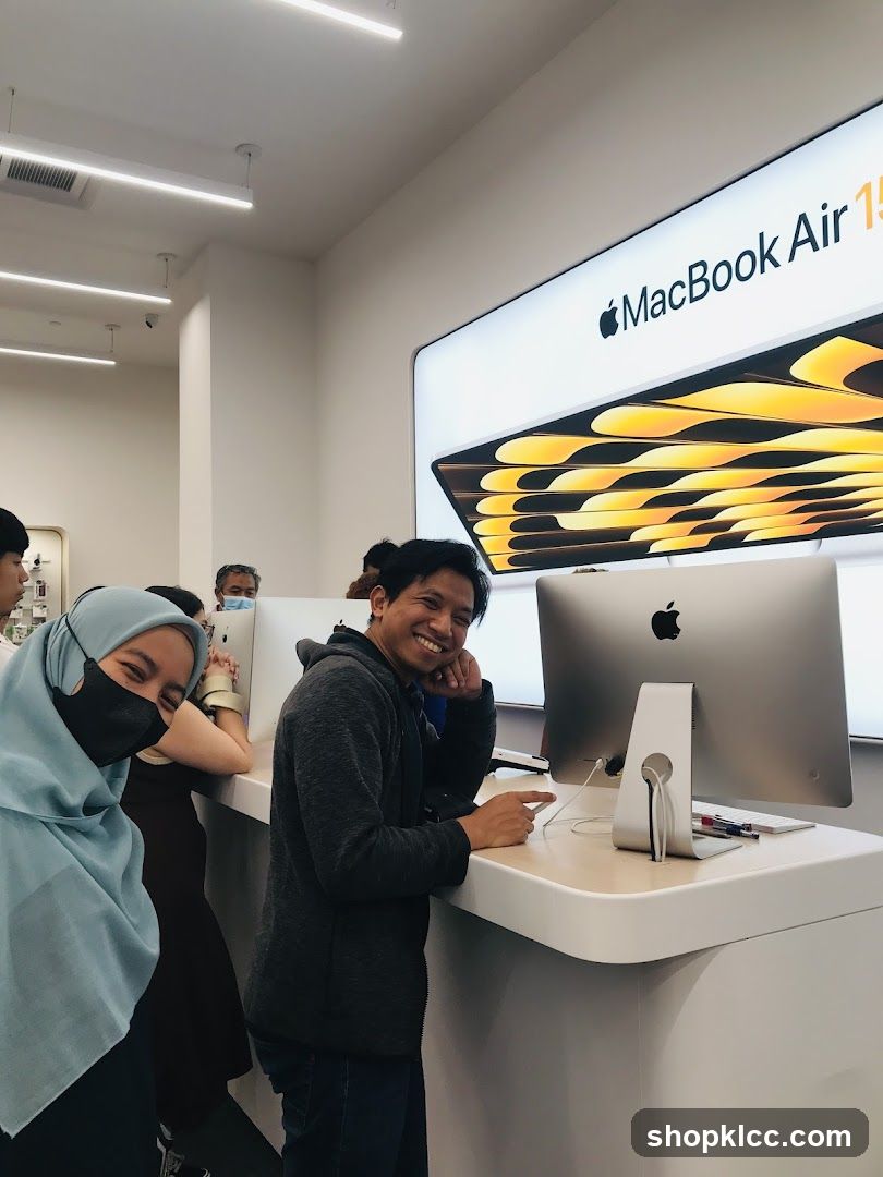 People looking at Apple products