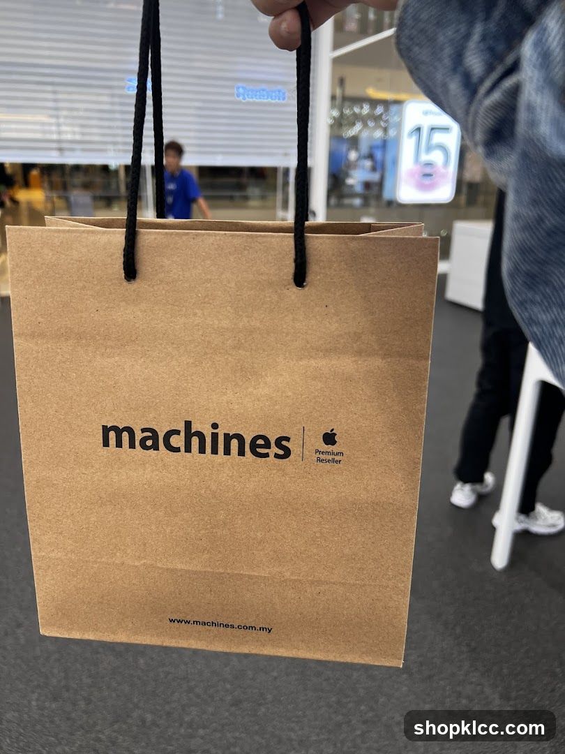 Brown paper shopping bag with "machines" logo