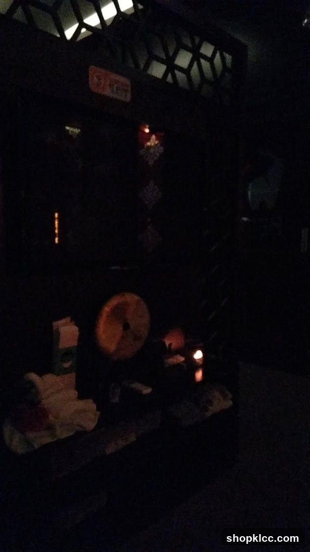 Dimly lit interior with shrine-like setup