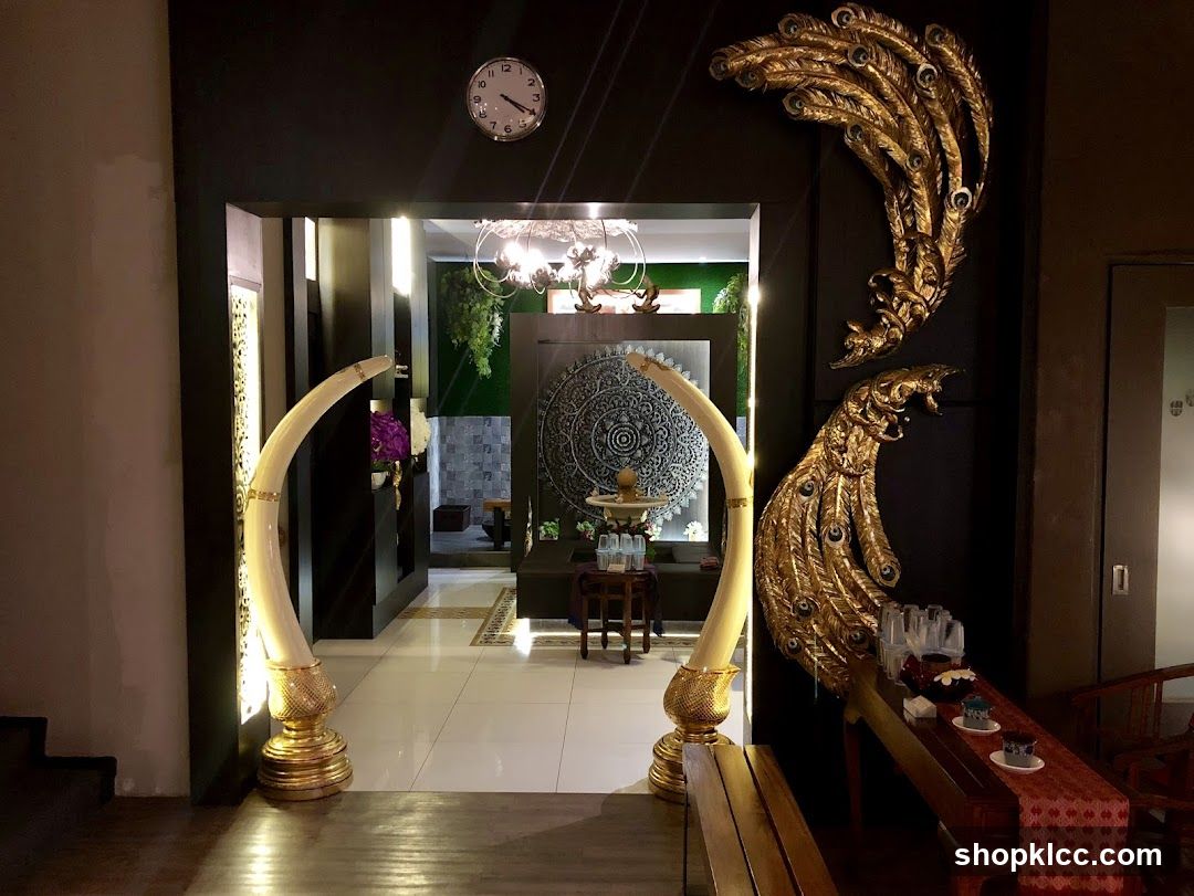 Decorated Interior Entrance with Elephant Tusks and Peacock Art