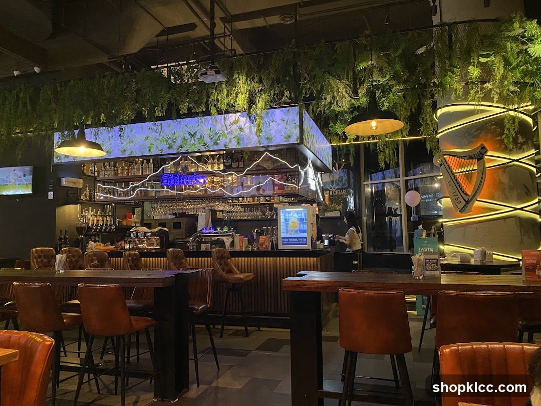 Bar Interior with Greenery and Harp Signage