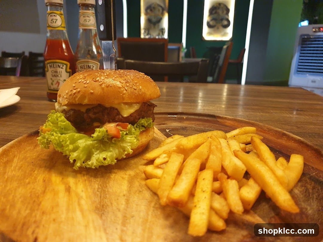 Burger and Fries on Wooden Board