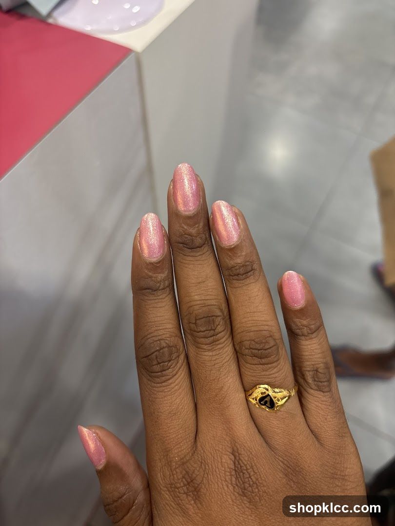 Woman's Hand with Pink Nail Polish