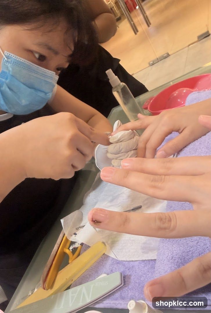 Nail Technician Working on Client's Nails