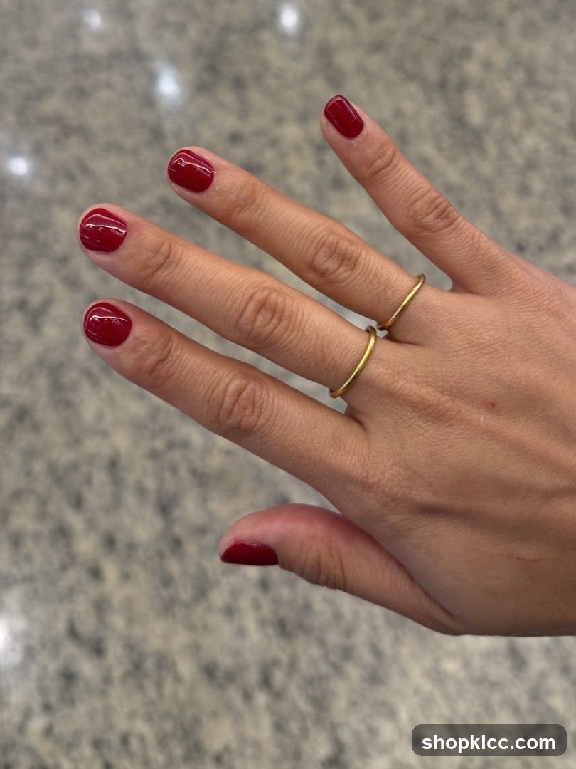 Hands with Red Nail Polish and Rings