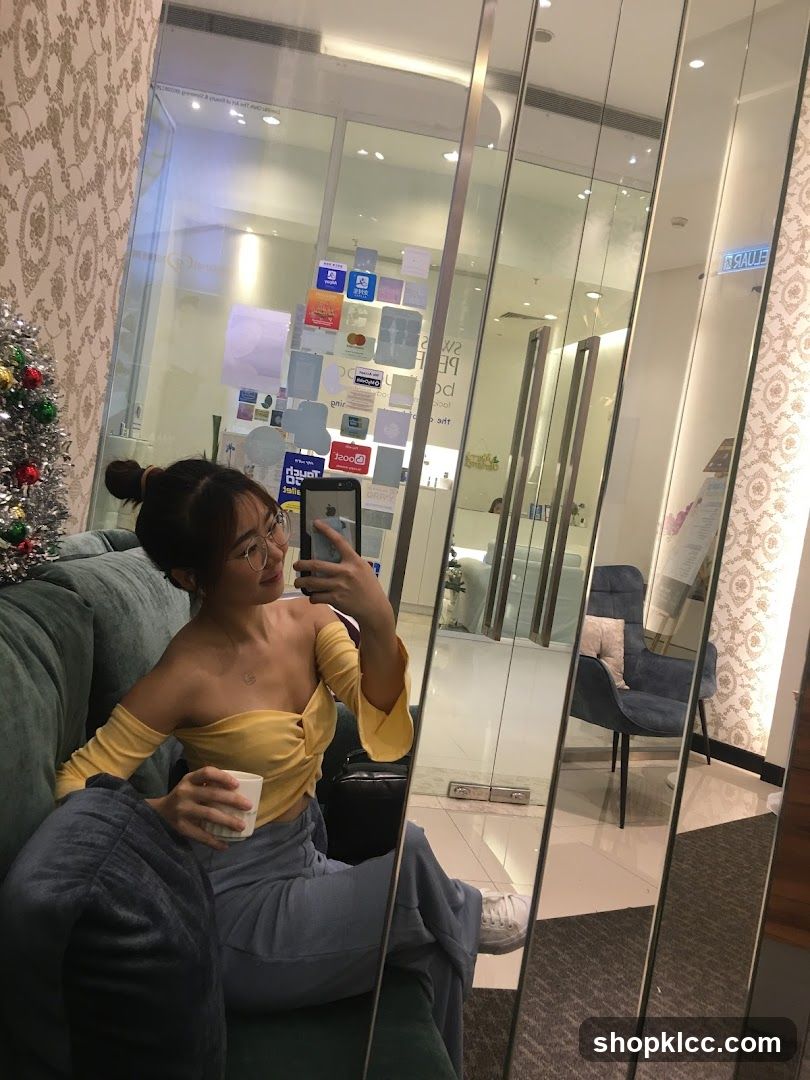 Woman taking a selfie in a salon