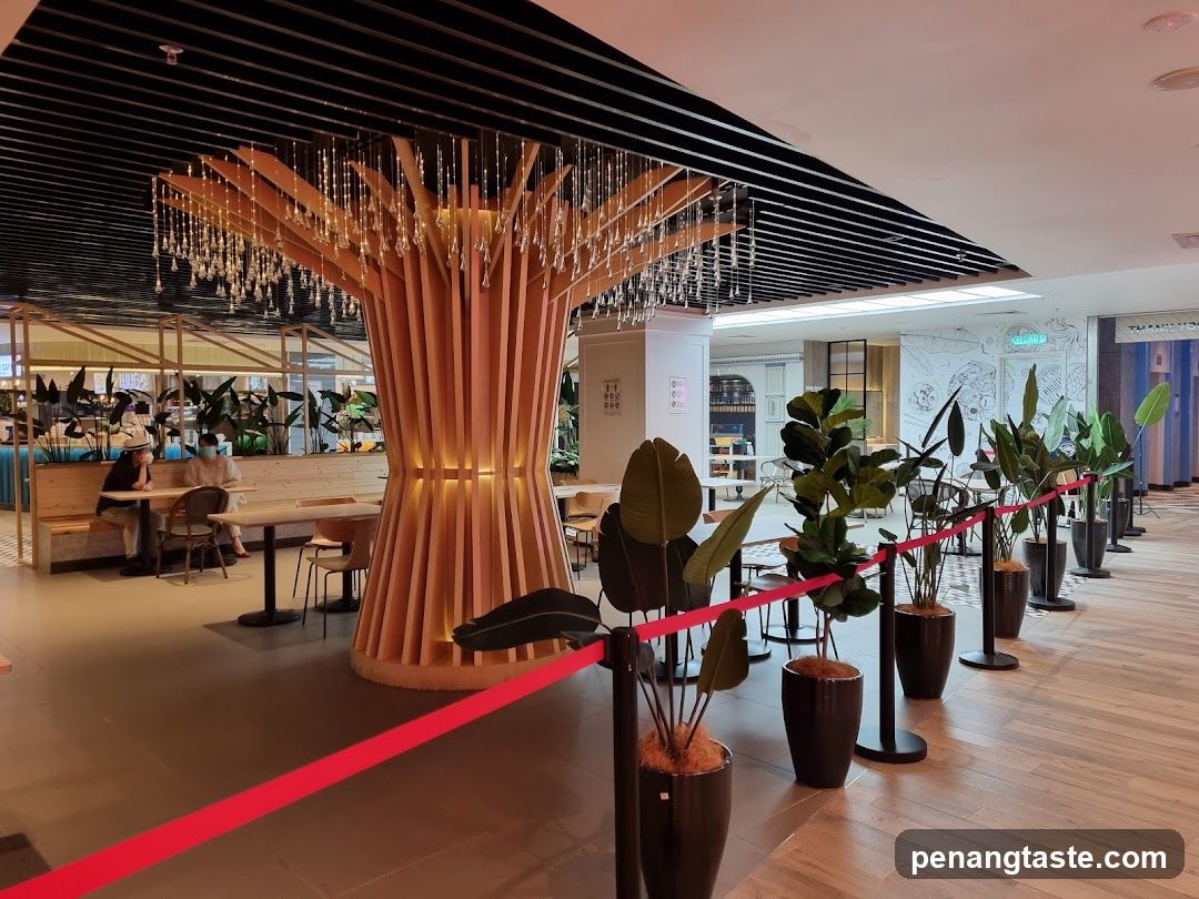 Indoor seating area with decorative tree and plants