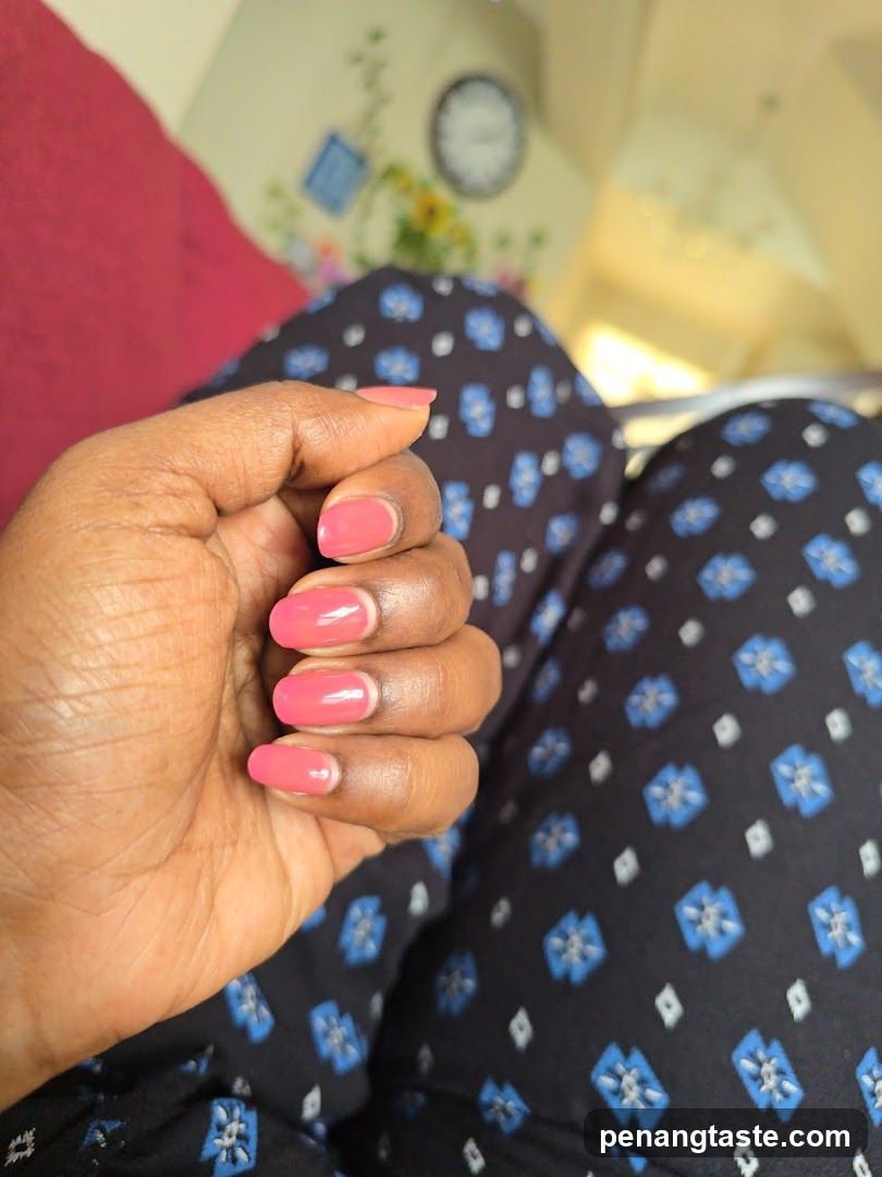 Woman's Hand with Pink Nail Polish