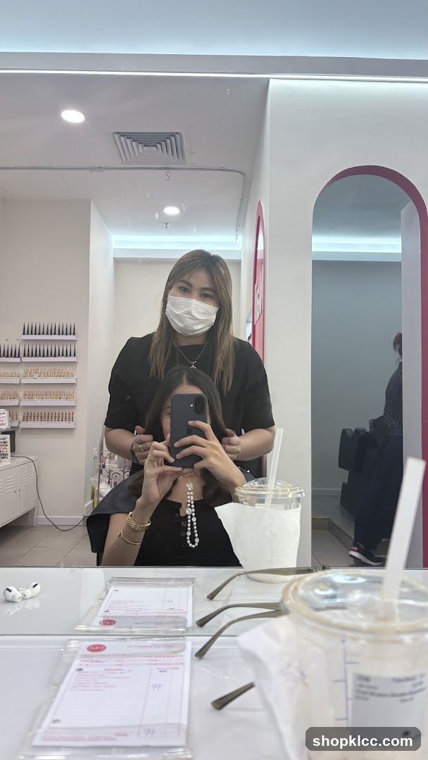 Hairdresser and client in salon