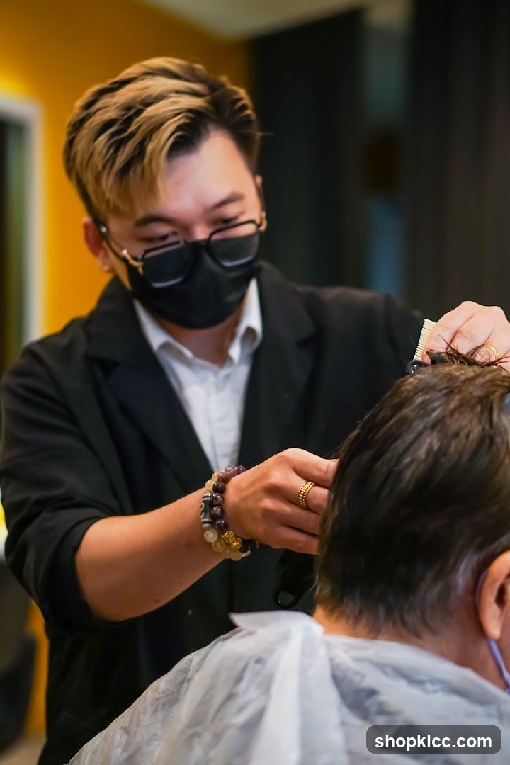 Hairdresser cutting client's hair