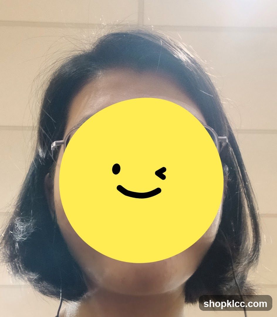 Person with a yellow circle covering their face