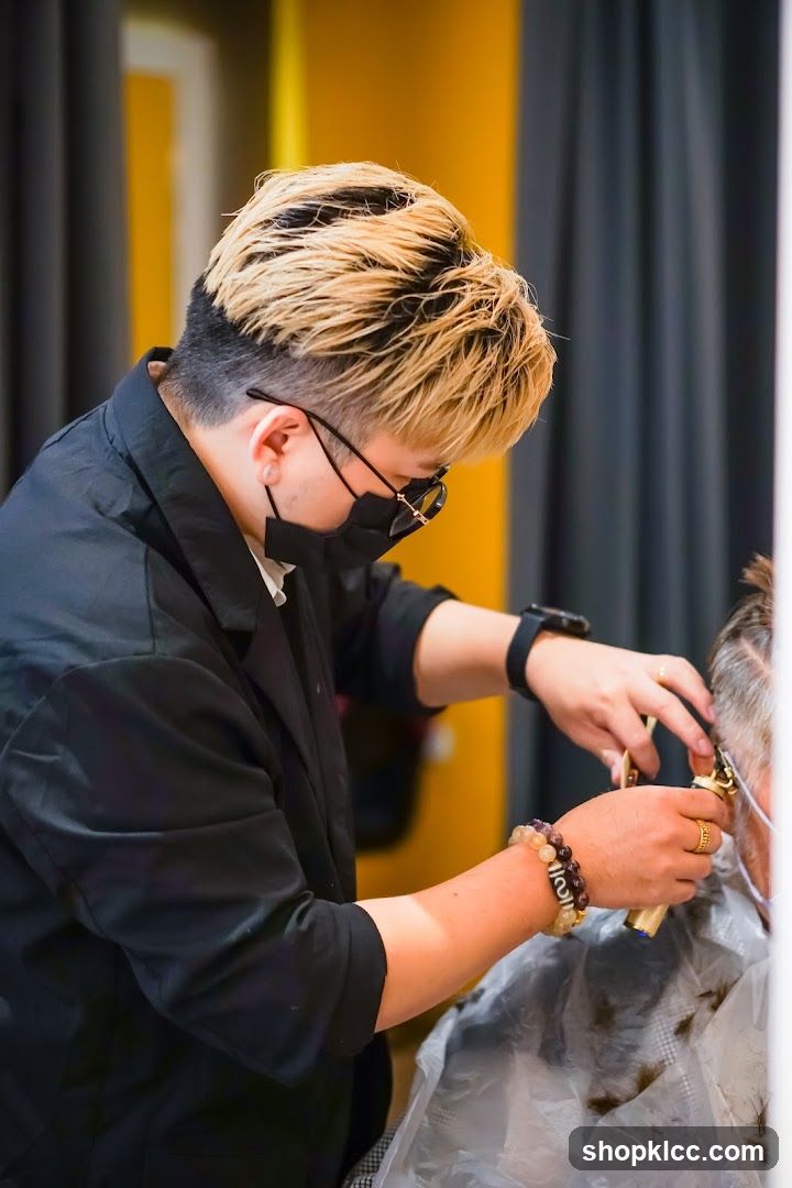 Hairdresser cutting client's hair