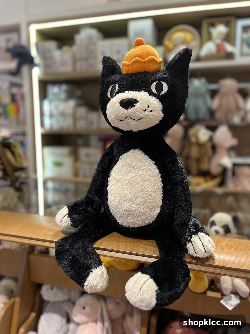 Black and White Cat Plush Toy with Orange Hat
