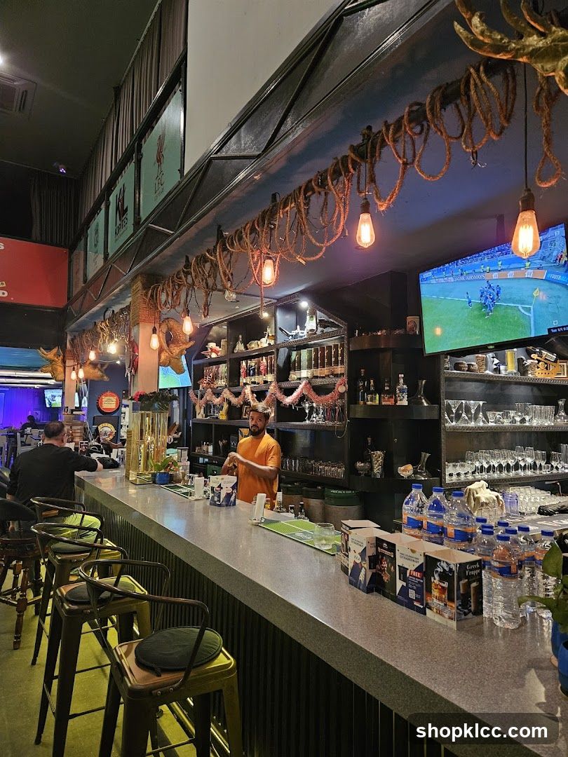 Bar Interior with Barista and TV Screen