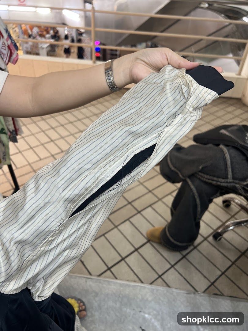 Person holding a striped garment