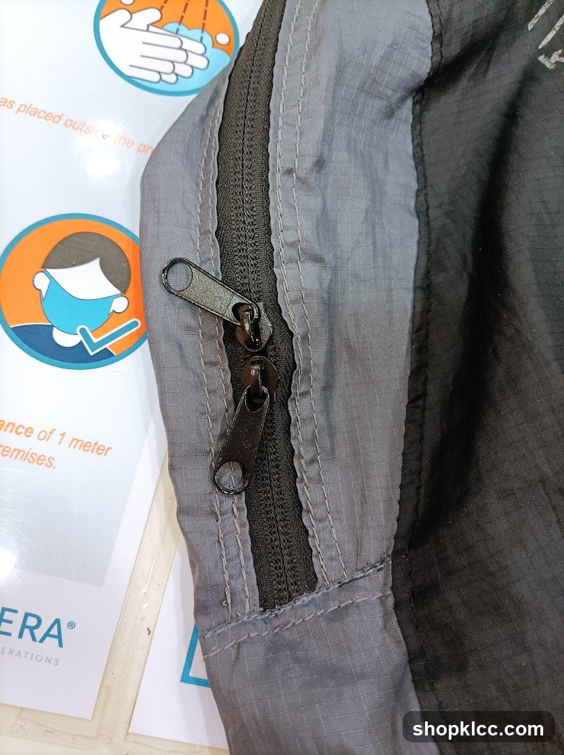 Zipper detail on jacket with safety signage