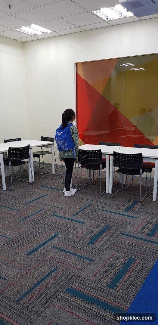 Student with backpack in a classroom