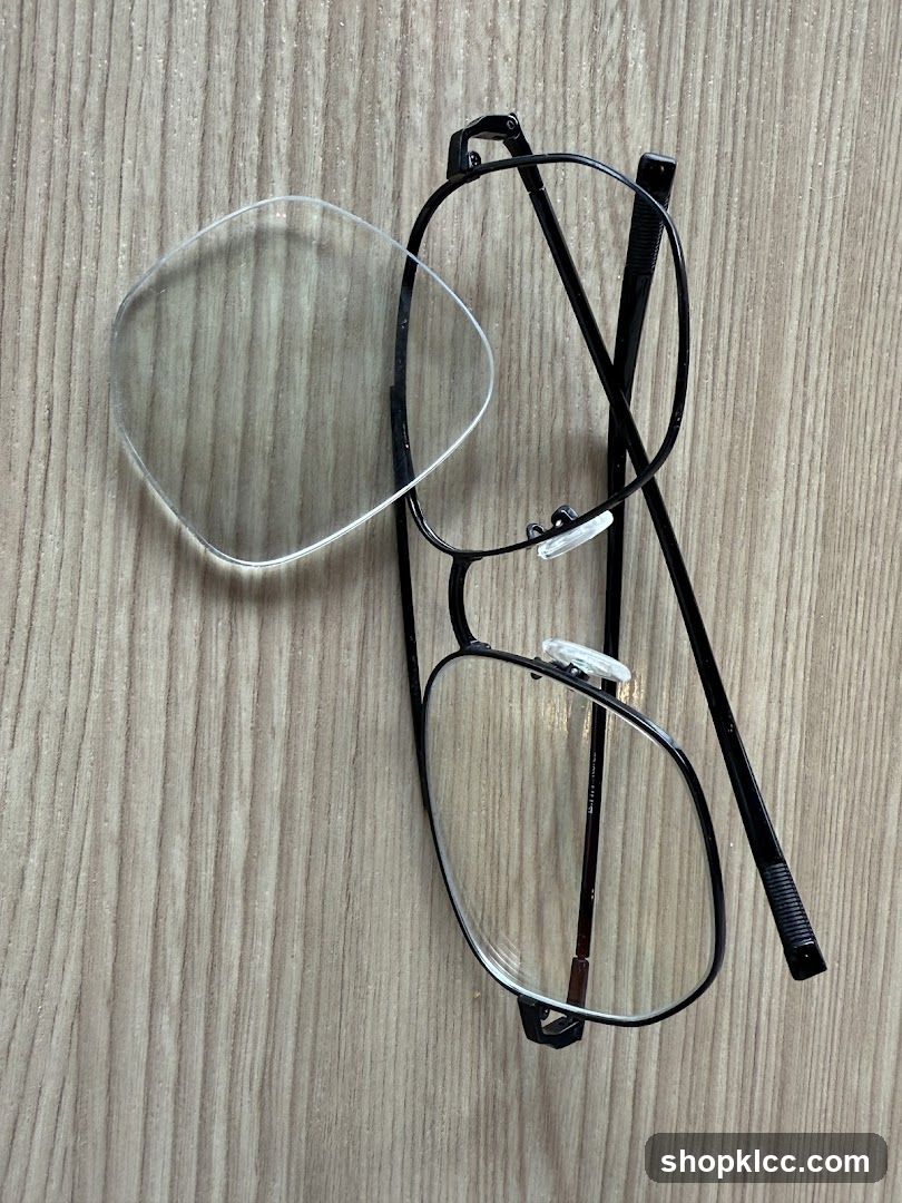 Eyeglasses and Lens on Wood Surface