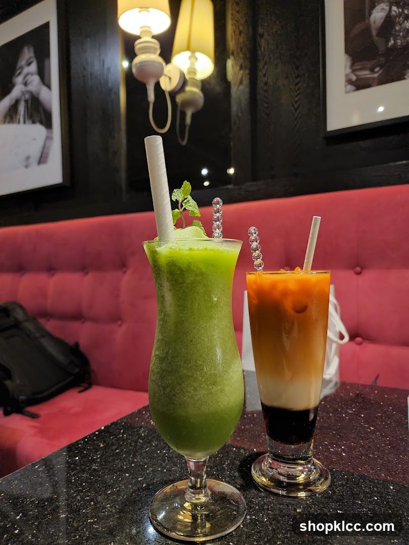 Two colorful drinks on a table