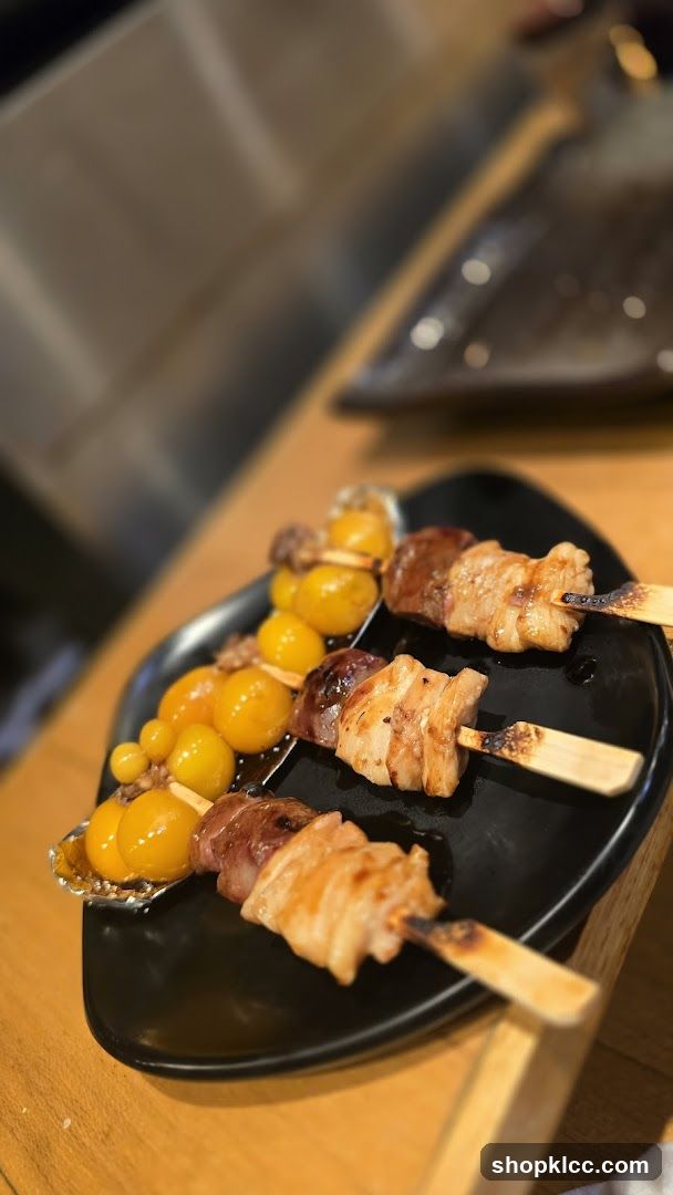Skewers of grilled meat and quail eggs