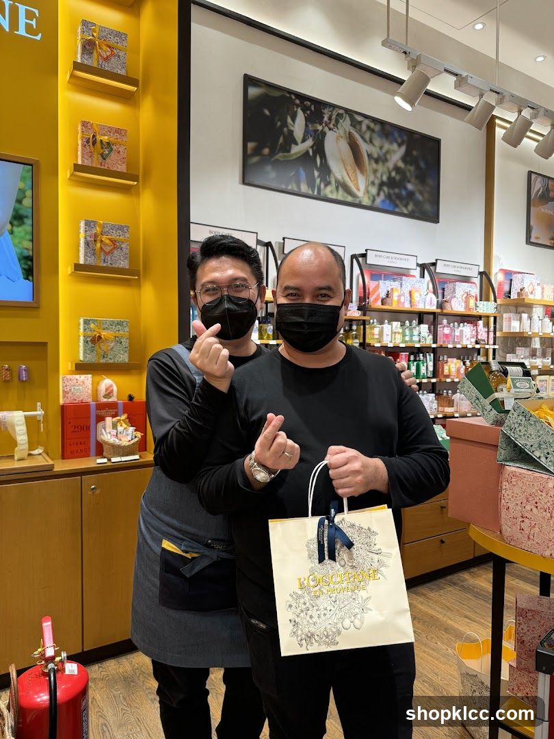 Two Men Posing with Shopping Bag in Store