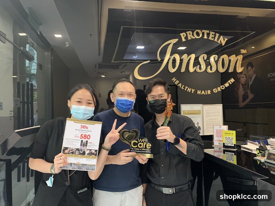 Staff with promotional material and award