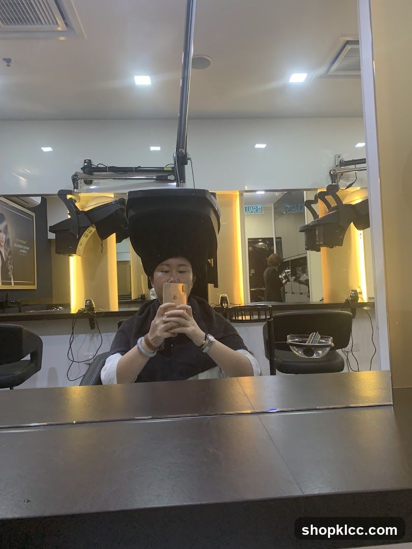 Woman under hair dryer