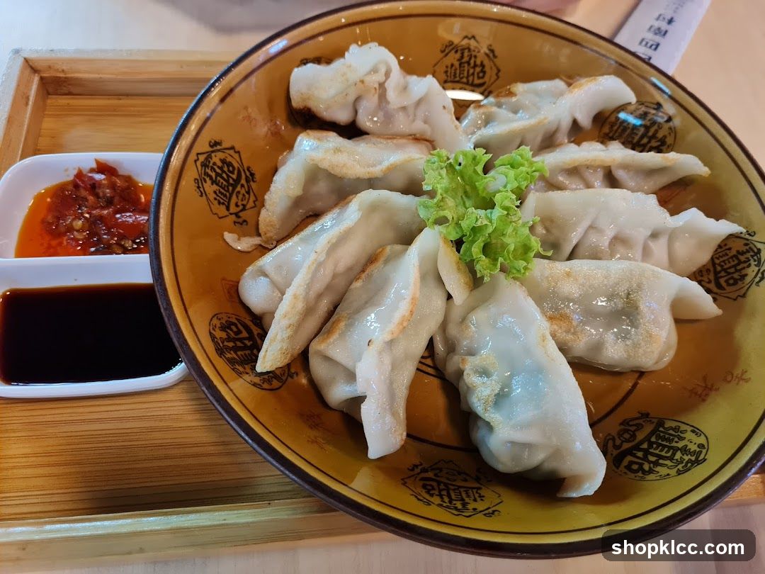 Pan-fried dumplings with dipping sauces