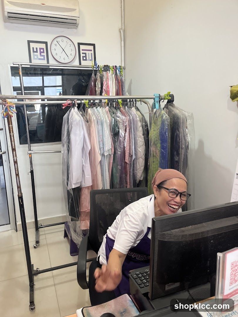 Dry Cleaner Employee at Desk