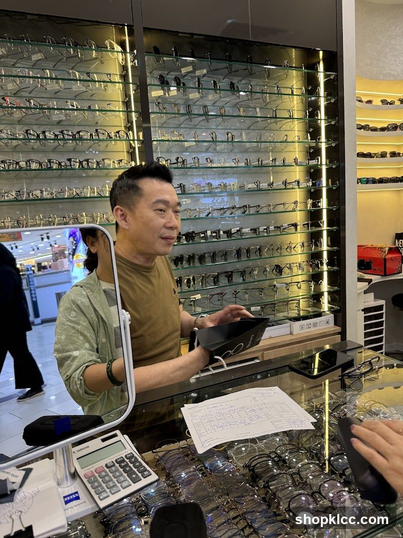 Optician assisting customer