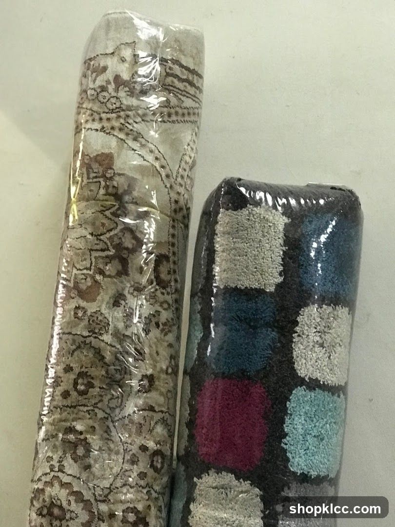 Two rolled rugs