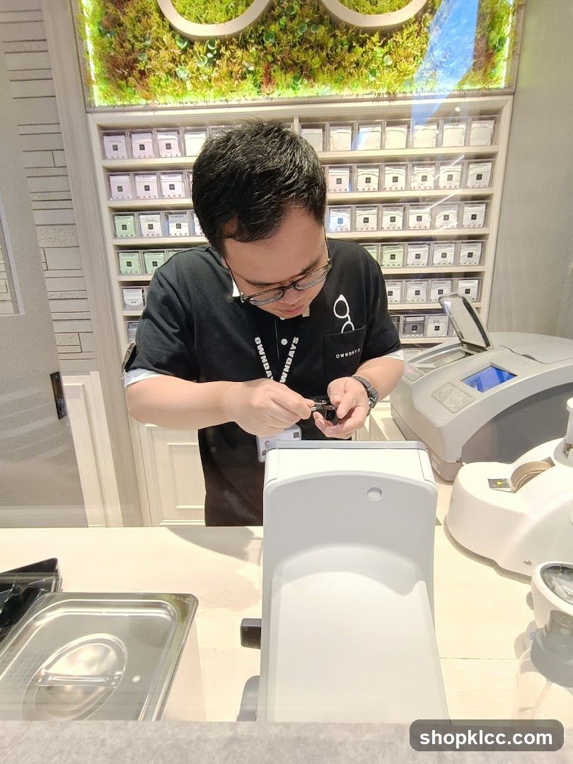 Optician working at counter