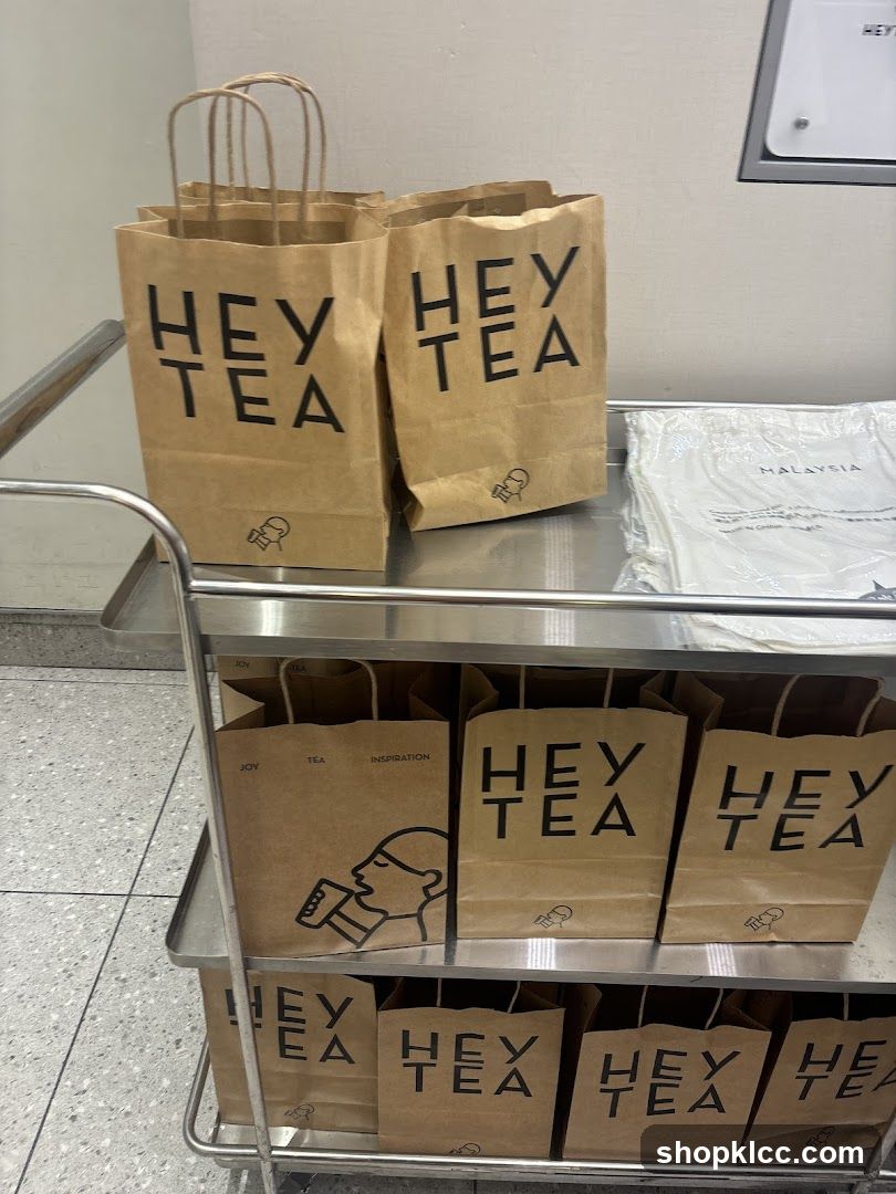 Brown Paper Bags with "Hey Tea" Logo