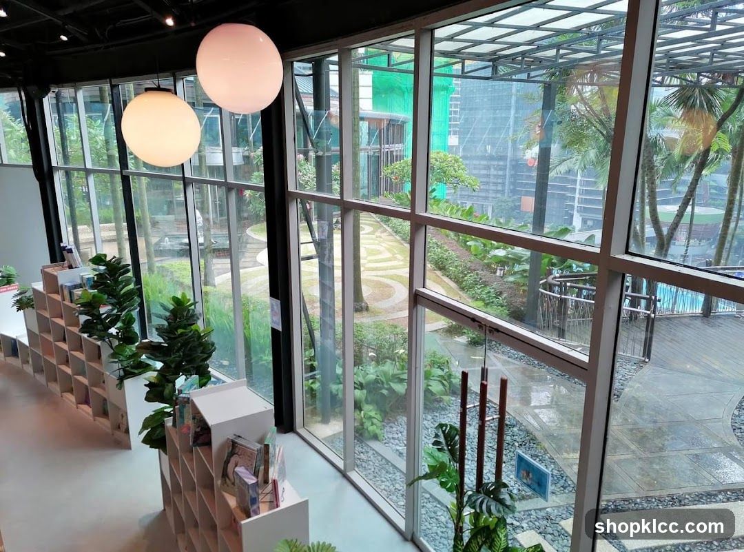 Interior of a modern space with bookshelves and a view of an outdoor garden