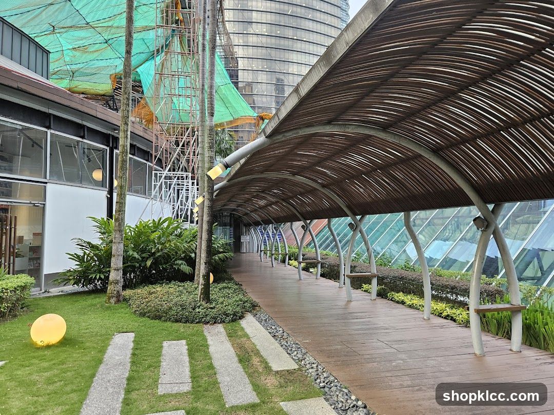 Covered walkway with benches and greenery