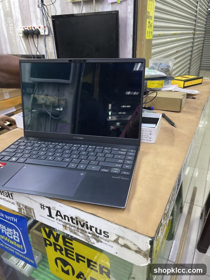Laptop on a counter with promotional materials