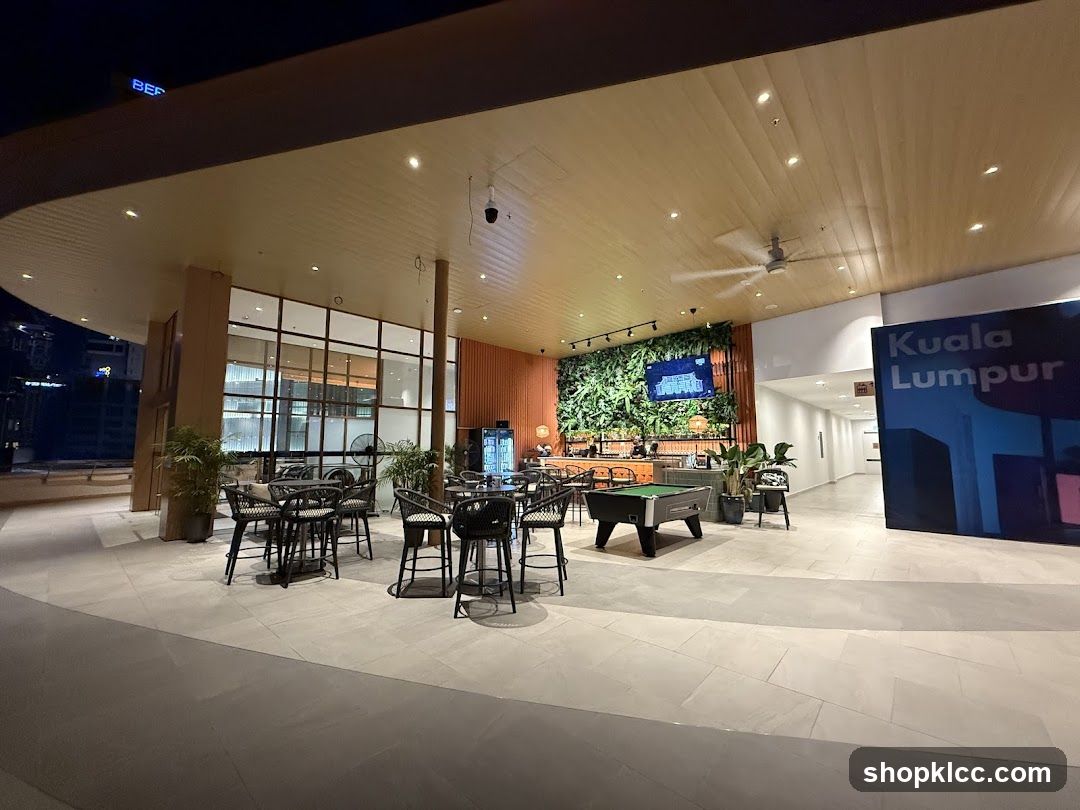 Outdoor seating area with pool table and greenery