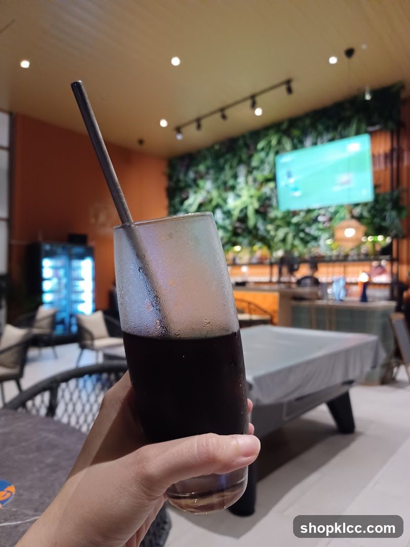 Drink in a glass with a straw