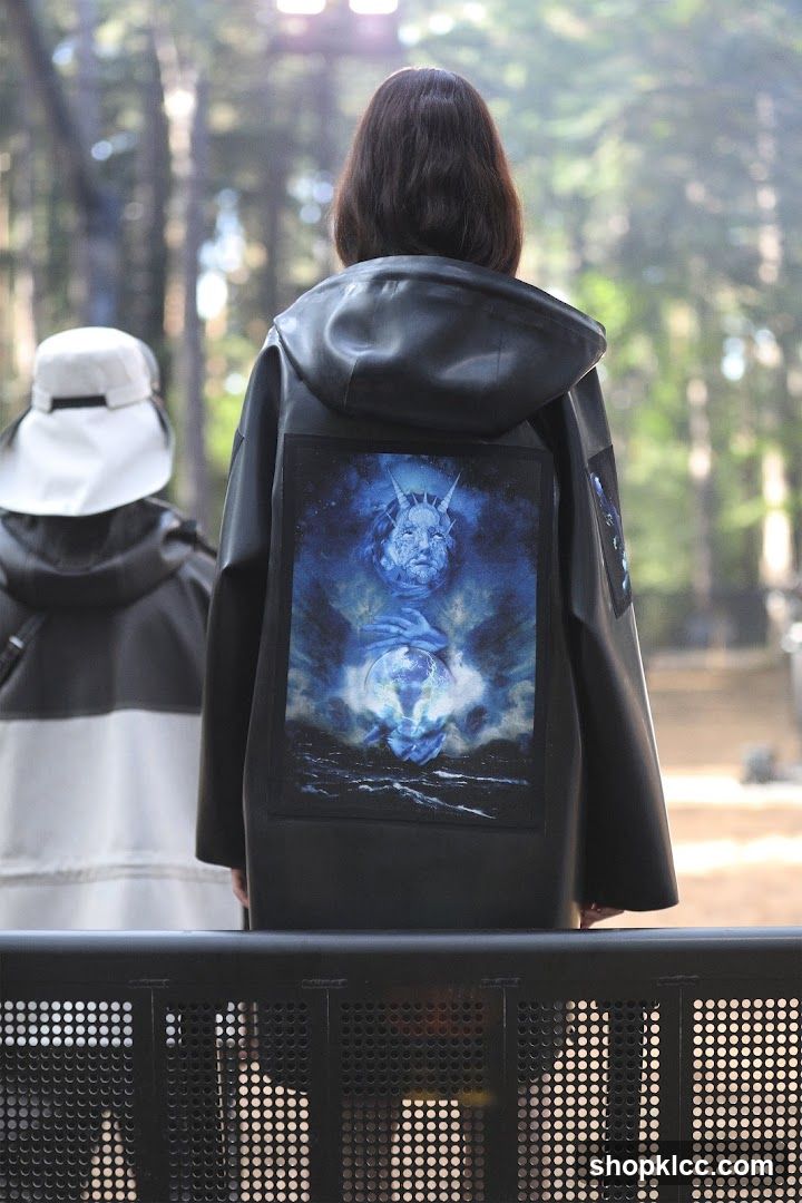 Back of person wearing jacket with graphic